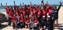 Volunteers help - Brigada do Mar - clean up a beach